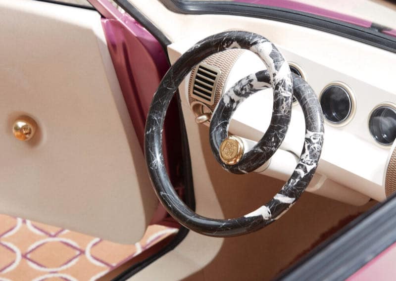The steering wheel takes the design of designer furniture by Pierre Gonalons